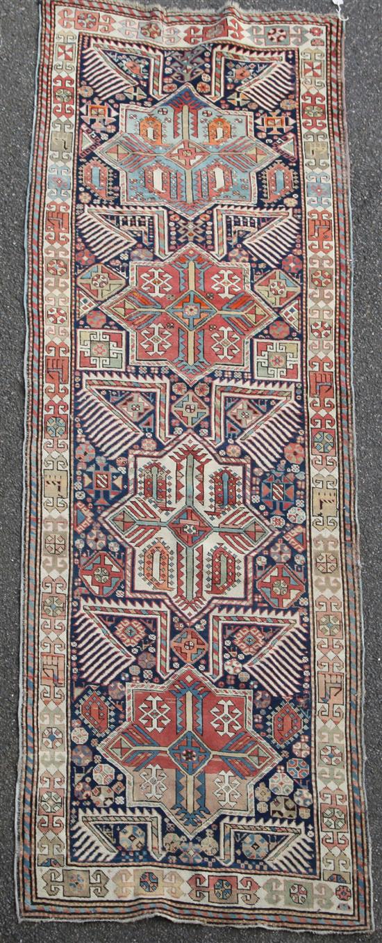 An Akstafa blue ground rug, c.1860, 9ft 4in by 3ft 6in.